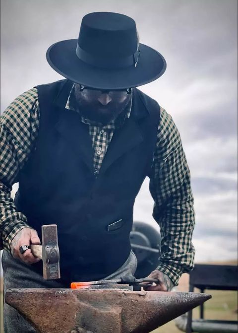 Brando hammering hot iron at a living history demonstration